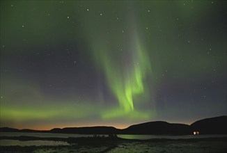 Northern lights (aurora borealis) and evening glow, fjord at low tide, Offersöy, FV 17,