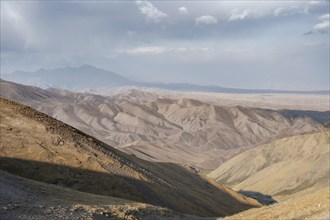 View of mountain landscape at Tyibel Pass, Song Kul Too mountain range, Naryn region, Kyrgyzstan,