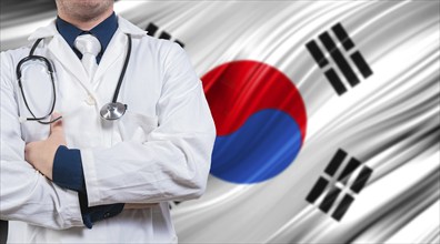 Doctor with stethoscope on South Korean flag. Doctor with crossed arms on South Korean flag.