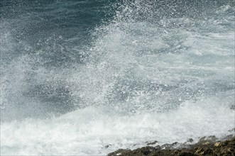 Surf, spray, waves breaking on the rocky coast in Majorca, Spain, Europe