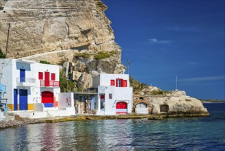 Scenic picturesque greek fishing village Klima with whitewashed traditional houses and colorful