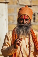 JAISALMER, INDIA, NOVEMBER 28, 2012: Indian sadhu (holy man) blessing. Sadhus are holy men who live