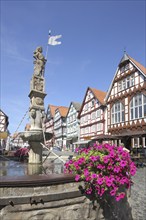 Half-timbered houses with market fountain, Rolandsbrunnen, market square, Fritzlar, Hesse, Germany,