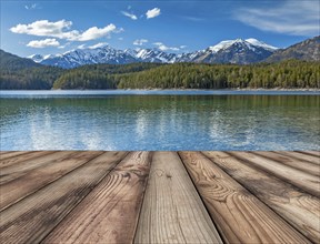 Wooden planks background with lake in Alps, Bavaria, Germany, Europe