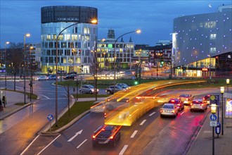 Evening city traffic in Essen, Germany, large intersection, roundabout, Berliner Platz, Berlin