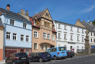 Old town with Renaissance-style museum, plague column column on the right, Krupka, Graupen,