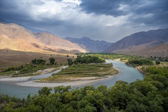 Green river valley with Naryn river between mountains, mountain landscape near Kazarman, Naryn