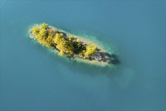 Bird's eye view of the chive island in the turquoise waters of Lake Walen in the canton of St.