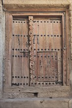 Old wooden door in Mutrah Fort, Muscat, Oman, Asia