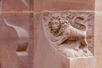 Lion carved in stone on the round arch of a window of the New Town Hall in Rathausgasse, Freiburg