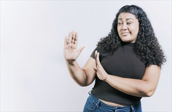 Displeased young woman rejecting with palms hands isolated. Disgusted young woman with rejection