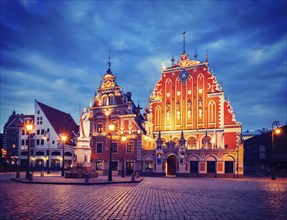 Vintage retro effect filtered hipster style image of Riga Town Hall Square, House of the Blackheads