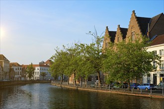 Typical Belgian cityscape Europe tourism concept, canal and old houses on sunset. Bruges (Brugge),