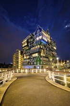 ZAANDAM, NETHERLANDS, MAY 21, 2018: Inntel Hotel in Zaandam illuminated at night. Design of