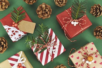 Top view of beautiful red, white and natural brown decorated Christmas gift boxes with ribbons and