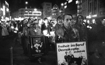 Nazi victims, some in concentration camp uniforms, demonstrated against the occupational bans