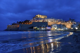 Old town with the Romanesque castle from the 14th century, blue hour, Peñíscola, province