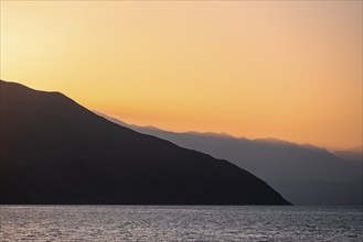 Lake and mountain landscape at sunset, Toktogul reservoir, Jalalabad region, Kyrgyzstan, Asia