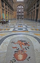 Floor mosaic in the Galleria Umberto I, shopping arcade in the old town of Naples, Campania, Italy,