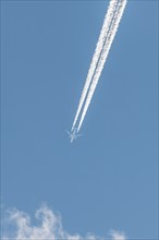 Airliners in flight in a blue sky in late summer. France