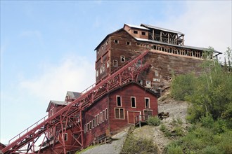 Old industrial ruins on the hillside, copper mining, red wooden buildings, ghost town, Unesco World