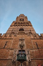 Brugge Belfry tower facade of famous tourist destination at Grote markt square in Bruges, Belgium