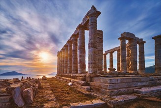 Greece Cape Sounio. Ruins of an ancient temple of Poseidon, Greek god of the sea, on sunset. Shot