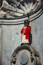 Brussels, Belgium, May 29, 2018: Famous tourist attraction of Brussels, dressed Manneken Pis statue