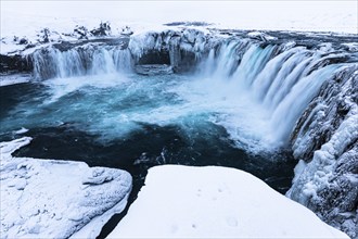 Godafoss waterfall, icy and snowy rock face, Northern Iceland Eyestra, Iceland, Europe