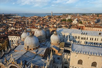 View of Venice with famous St Mark's Basilica and Doge's Palace on sunset from St Mark's Campanile