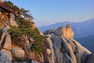 View of stones and rock formations from Ulsanbawi rock peak on sunset with staircase. Seoraksan