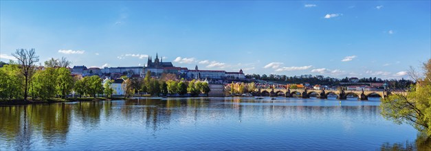 Panorama view of Charles bridge over Vltava river and Gradchany Prague Castle and St. Vitus