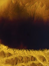 Detail of the Rio Tinto (Red river) with its deep reddish hue due to oxidised iron minerals in its