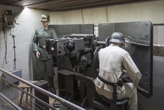 Diorama showing WW2 German soldiers operating gun in casemate, Musée Mémorial d'Omaha Beach museum,