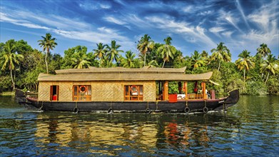 Travel tourism Kerala background, panorama of tourist houseboat on Kerala backwaters. Kerala,