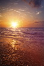 Ocean sunset, Hikkaduwa, Sri Lanka. With light leak and lens flare