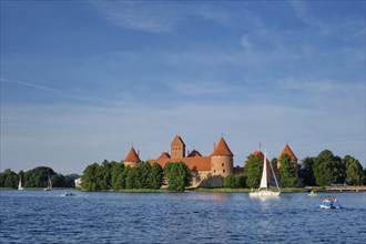 Trakai Island Castle in lake Galve with boats and yachts in summer day with beautiful sky,