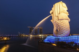 SINGAPORE, JANUARY 1, 2014: Night view of Singapore Merlion at Marina Bay and Marina Bay Sand