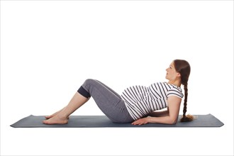 Pregnancy yoga exercise, pregnant woman doing yoga asana Purvottanasana Upward Plank Pose isolated