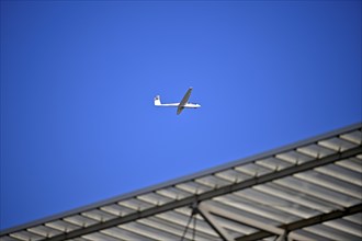 ASK 2 two-seater, D-6448, flies over stadium roof, sky, blue, PreZero Arena, Sinsheim,