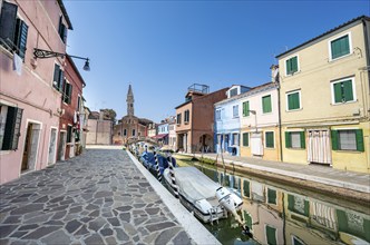 Colourful houses on the canal with reflection, canal with boats and colourful house facades, in the