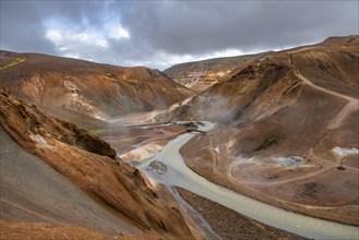 Steaming streams between colourful rhyolite mountains, Hveradalir geothermal area, Kerlingarfjöll,