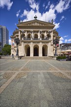 Old Opera House at Opernplatz under a blue sky with cumulus clouds in Frankfurt am Main, Hesse,