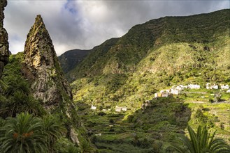 One of the twin rocks Roques de San Pedro, landmark of Hermigua, La Gomera, Canary Islands, Spain,