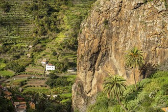 One of the twin rocks Roques de San Pedro, landmark of Hermigua, La Gomera, Canary Islands, Spain,