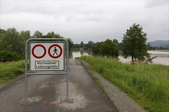 Symbolic image extreme weather, global warming, climate change, information board, flood retention