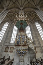 Pulpit with sandstone staircase in the late Gothic hall church of St George, Dinkelsbühl, Bavaria,