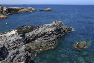 Cliff jumper at Cabo de Palos, near La Manga del Mar Menor, Murcia Province, Costa Cálida, Spain,