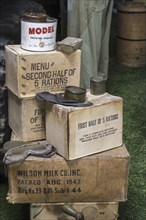 Pile of WW2 cardboard boxes with military rations, menus for American soldiers during World War Two