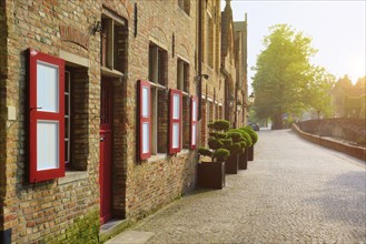 Door and windows of an old houses and street on sunset, Bruges (Brugge), Belgium, Europe